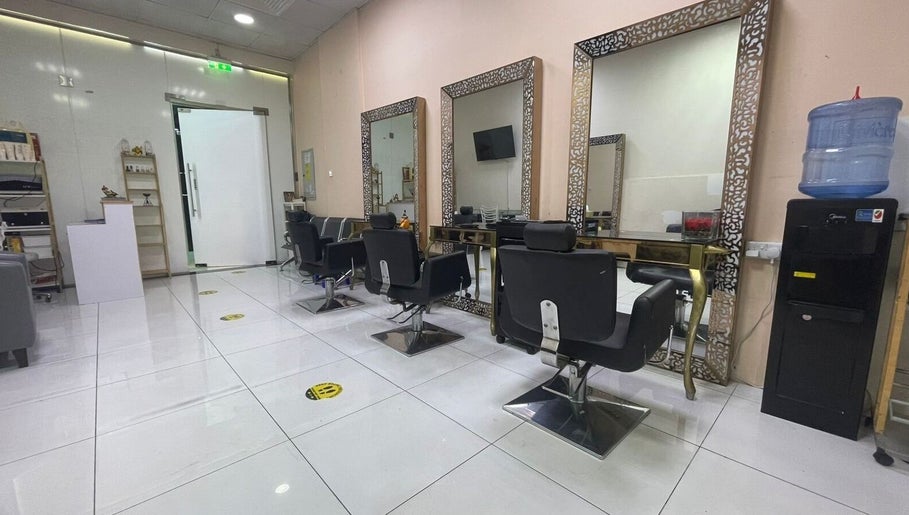 Chic interior of Sparkles N Charms Womens Beauty Salon in Dubai, AE with elegant styling stations.