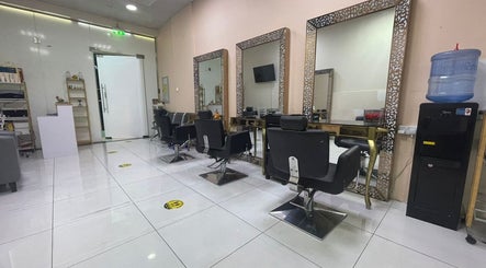 Chic interior of Sparkles N Charms Womens Beauty Salon in Dubai, AE with elegant styling stations.