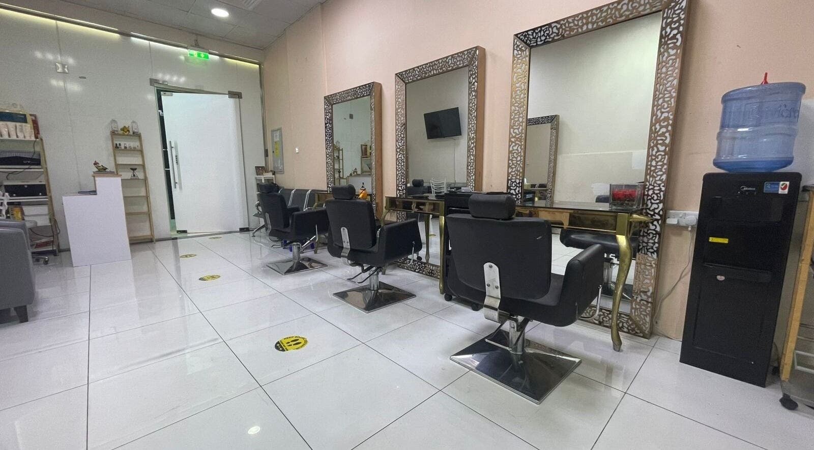 Chic interior of Sparkles N Charms Womens Beauty Salon in Dubai, AE with elegant styling stations.