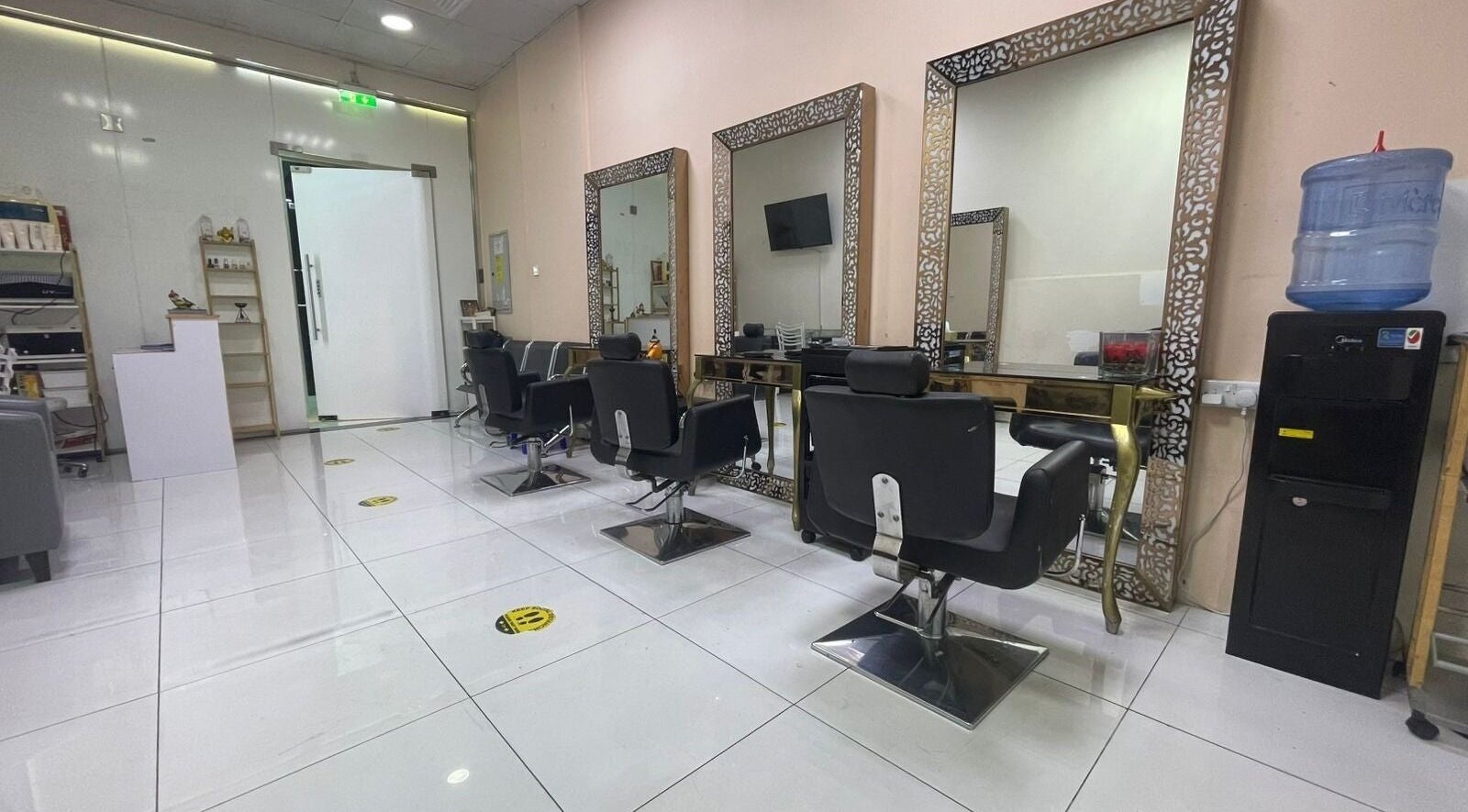 Chic interior of Sparkles N Charms Womens Beauty Salon in Dubai, AE with elegant styling stations.