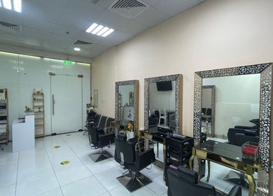 Interior of Sparkles N Charms Womens Beauty Salon in Dubai, AE showcasing elegant styling stations and decor.