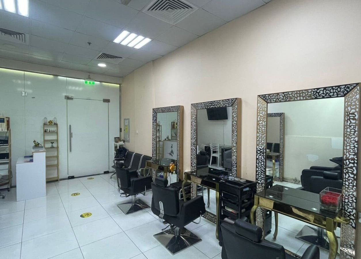 Interior of Sparkles N Charms Womens Beauty Salon in Dubai, AE showcasing elegant styling stations and decor.