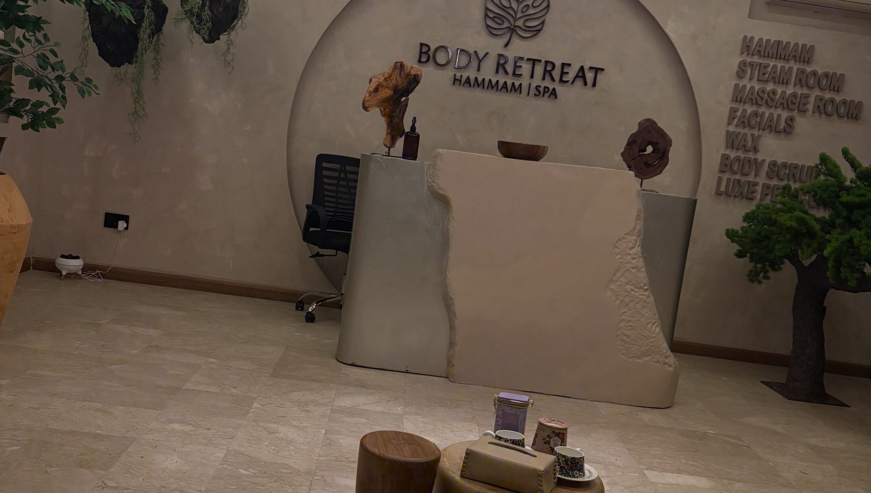 Reception area of Body Retreat Spa in Lagos, Lagos, NG, featuring a modern minimalist design with natural accents.