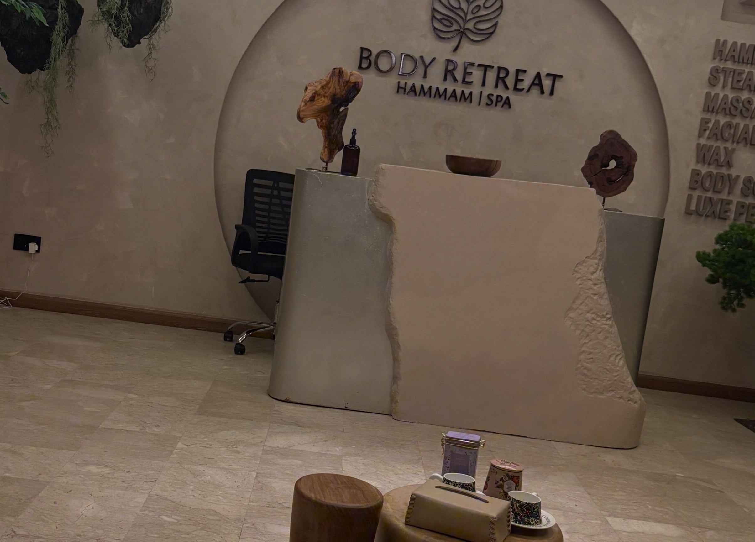 Reception area of Body Retreat Spa in Lagos, Lagos, NG, featuring a modern minimalist design with natural accents.