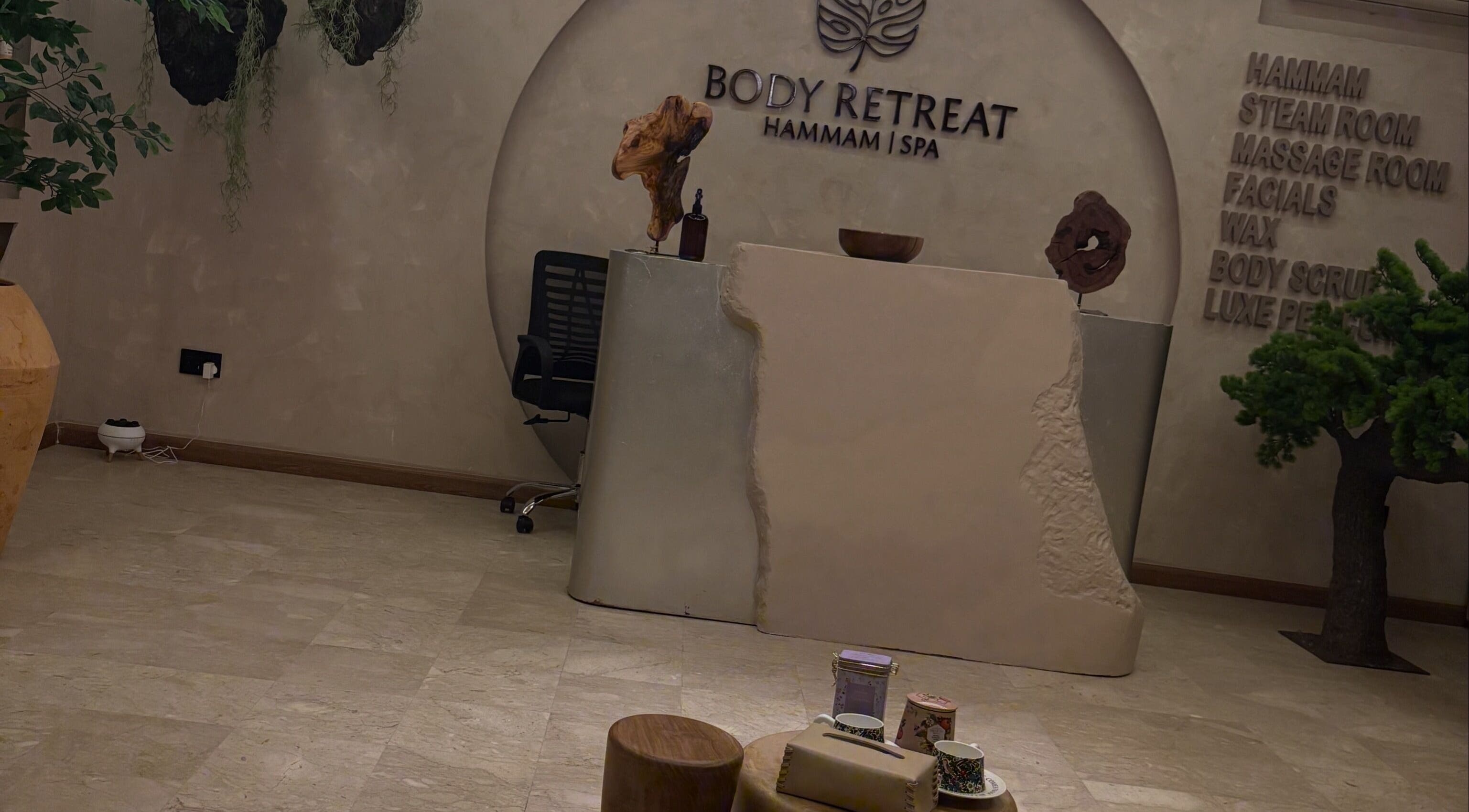 Reception area of Body Retreat Spa in Lagos, Lagos, NG, featuring a modern minimalist design with natural accents.