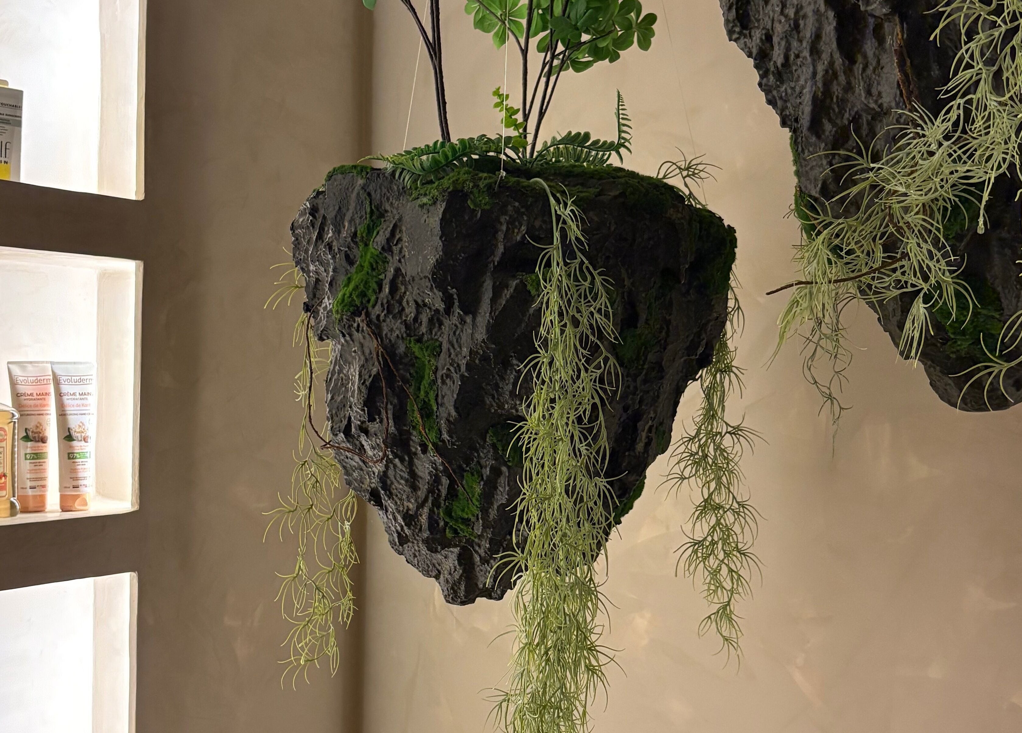 Floating plants and displayed products at Body Retreat Spa, Lagos, Lagos, NG create a serene atmosphere.