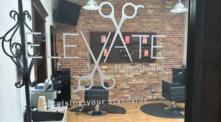 Entrance view of Elevate Hair Studio, showcasing classy interior in De Pere, WI, US.