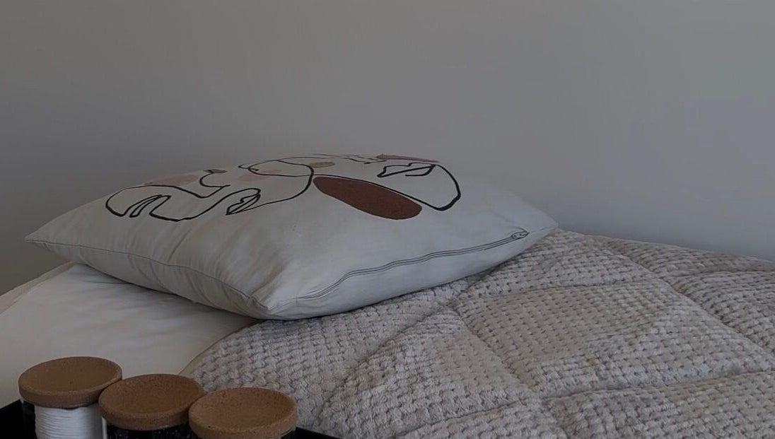 Elegant pillow and textured quilt at The Loft in Colchester, England, GB.