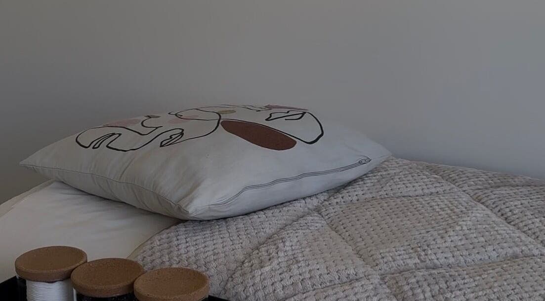 Elegant pillow and textured quilt at The Loft in Colchester, England, GB.