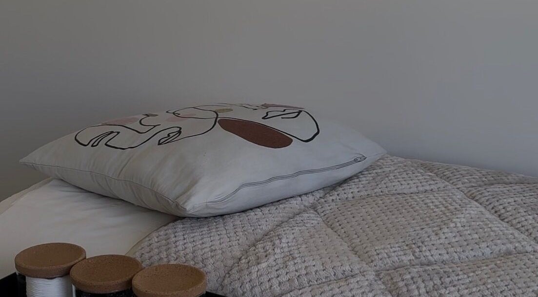 Elegant pillow and textured quilt at The Loft in Colchester, England, GB.