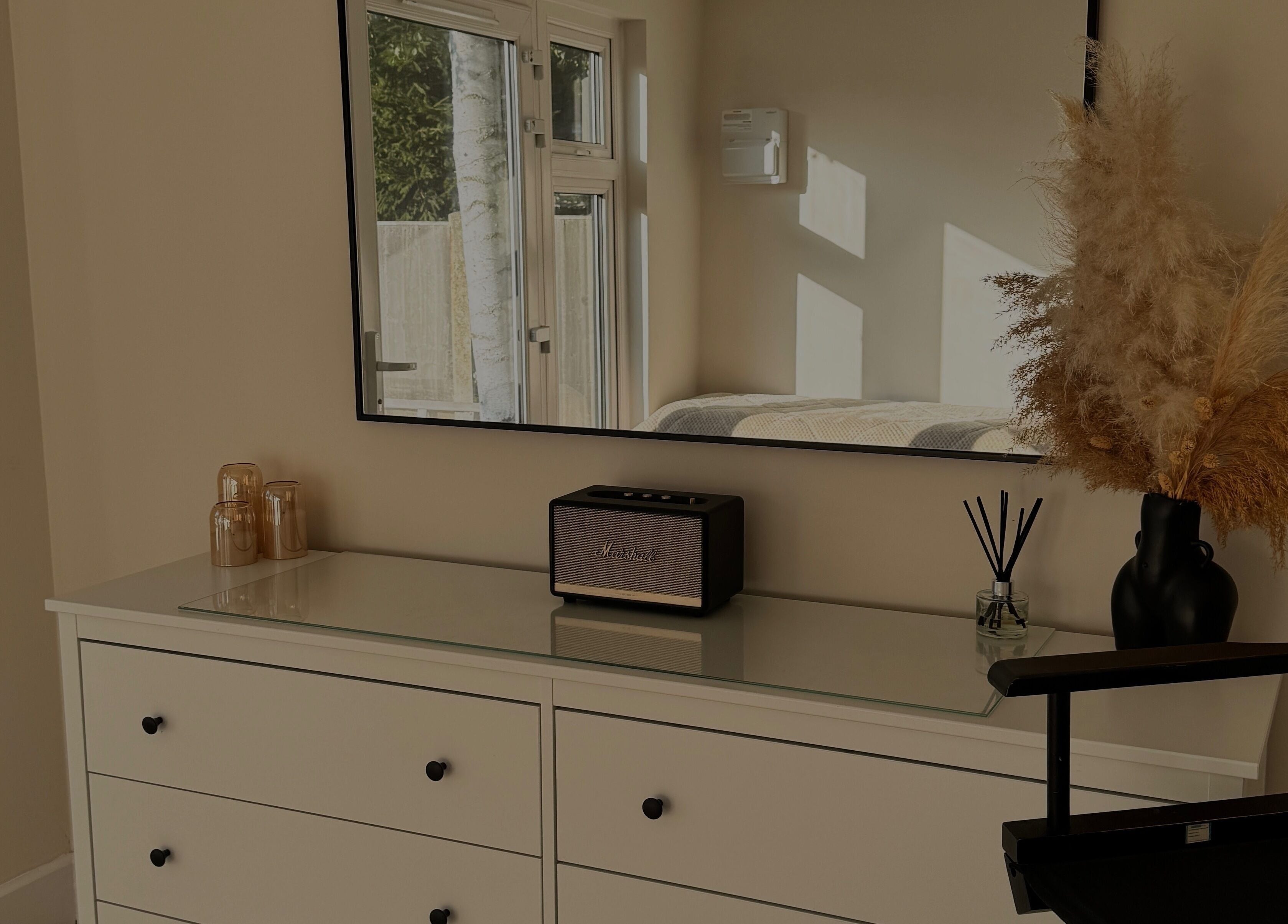 Sleek vanity setup with mirror at The Loft, Colchester, England, GB featuring pampas and stylish decor.