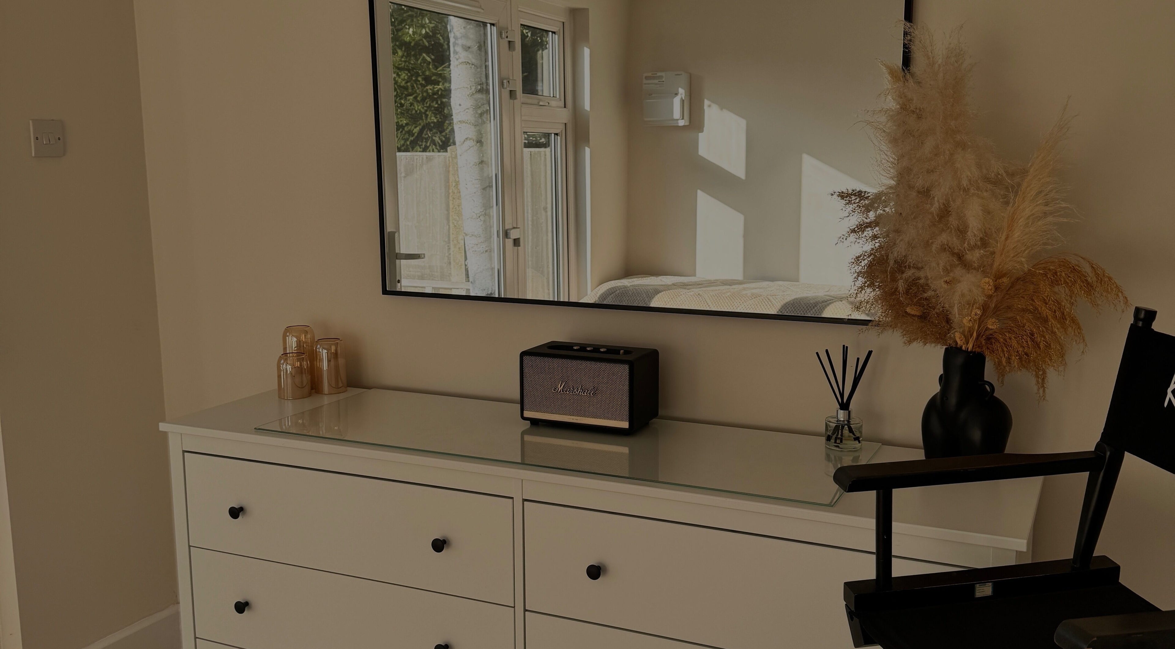 Sleek vanity setup with mirror at The Loft, Colchester, England, GB featuring pampas and stylish decor.