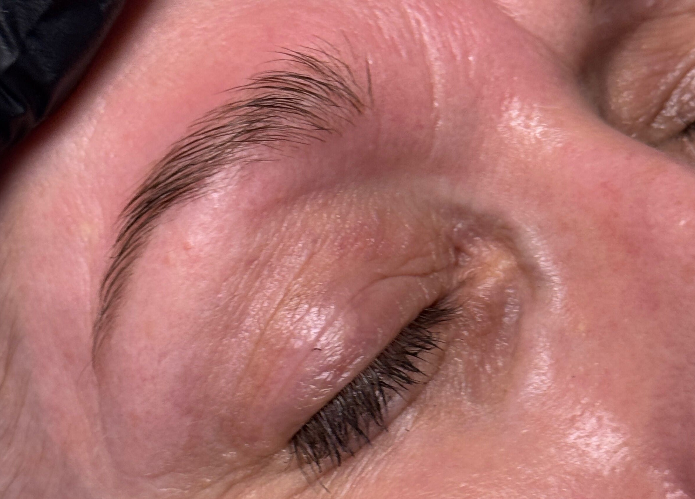 Close-up of eyebrow treatment at The Loft in Colchester, England, GB, showcasing smooth, well-groomed brows.