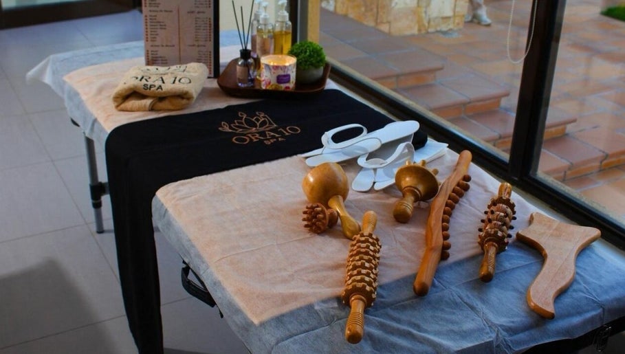 Relaxing setup with spa tools and slippers at ORA10 SPA - Home Service, Riyadh, Riyadh Province, SA.