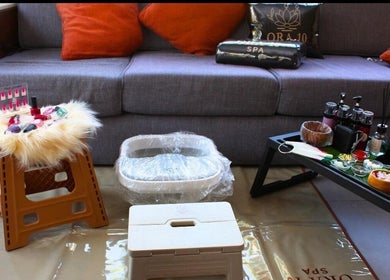 ORA10 SPA - Home Service in Riyadh, Riyadh Province, SA offers a cozy spa setup with manicure and relaxation tools.