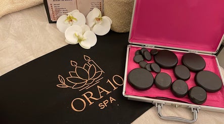 Relaxing hot stones at ORA10 SPA - Home Service in Riyadh, Riyadh Province, SA for ultimate wellness experience.