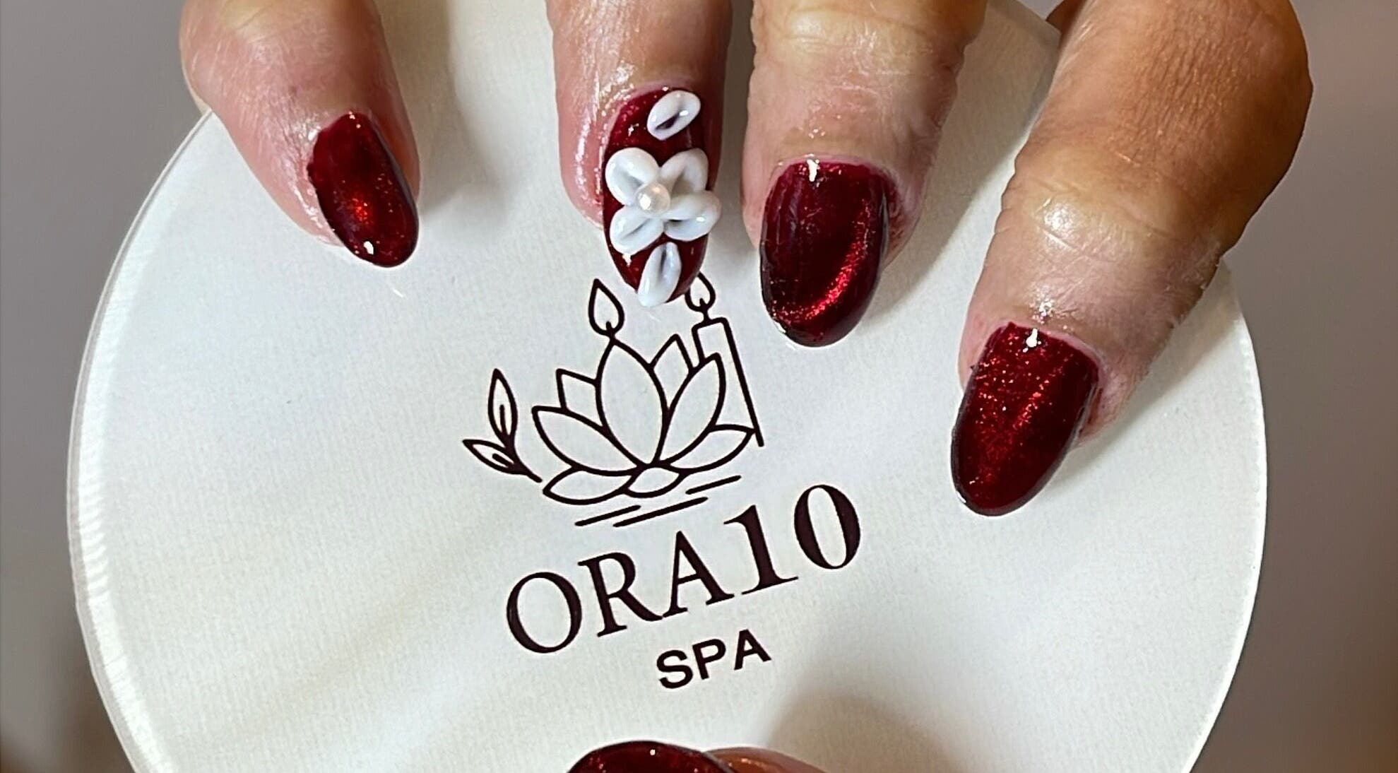 Luxurious nail art with white flower detail at ORA10 SPA - Home Service, Riyadh, Riyadh Province, SA.