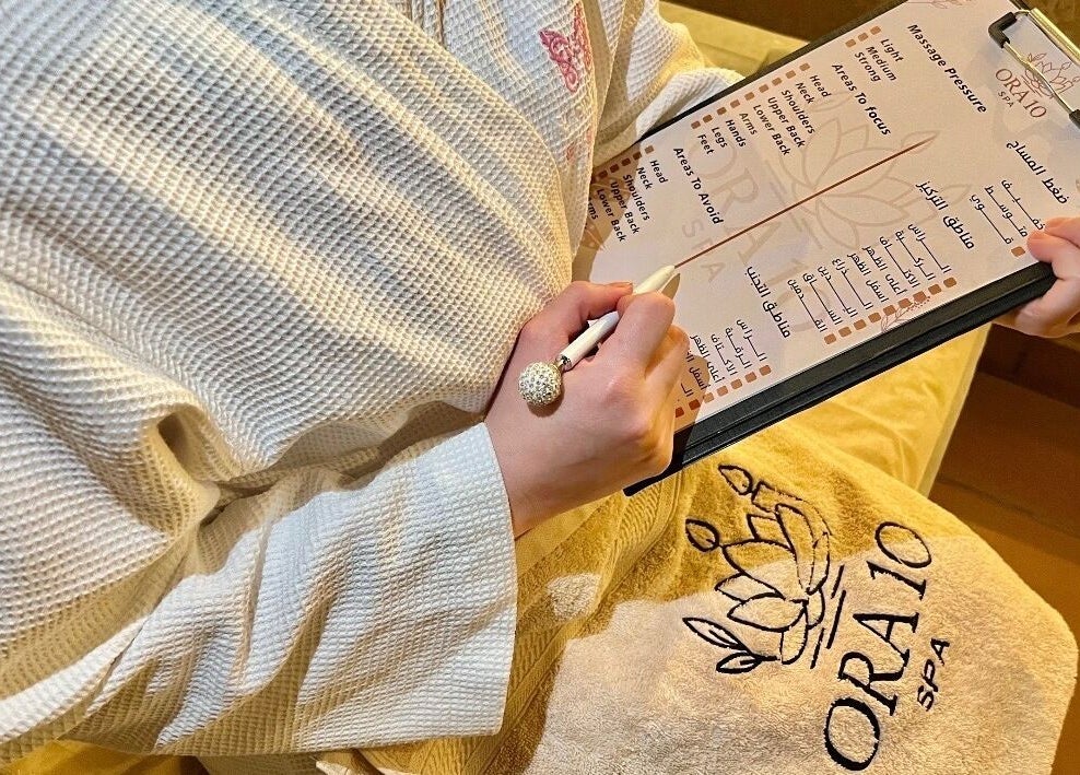 Guest reviewing ORA10 SPA - Home Service menu in Riyadh, Riyadh Province, SA for a personalized experience.