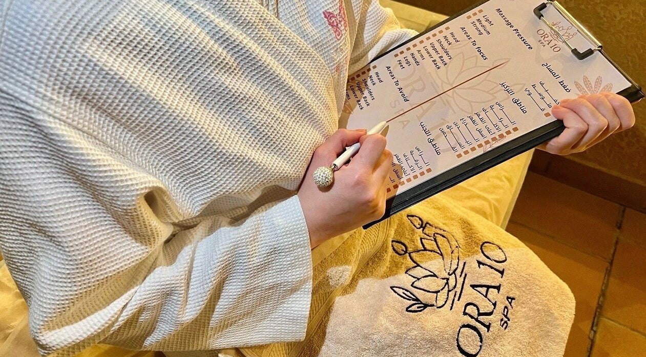 Guest reviewing ORA10 SPA - Home Service menu in Riyadh, Riyadh Province, SA for a personalized experience.