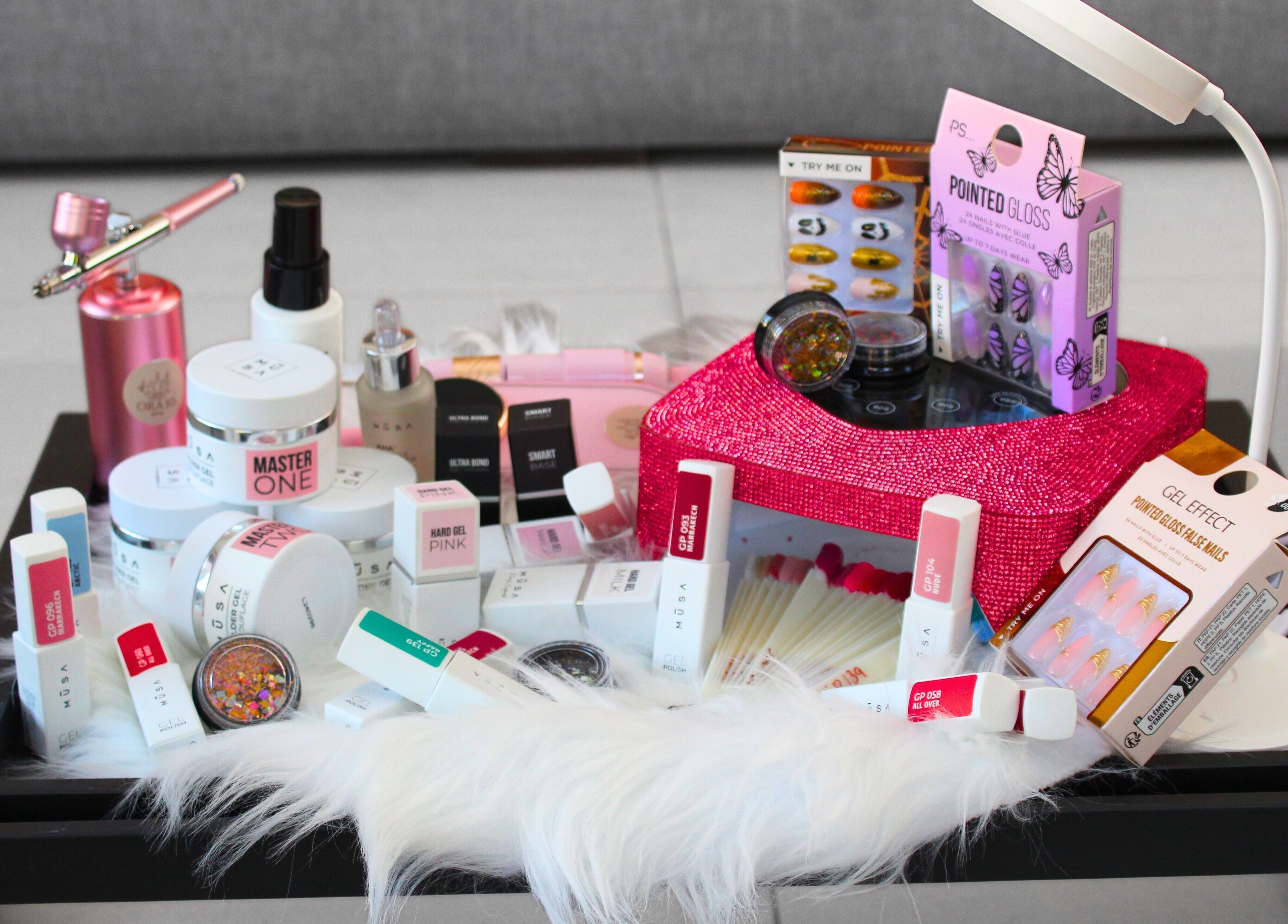 Assorted beauty products at ORA10 SPA - Home Service, Riyadh, Riyadh Province, SA on a stylish table.