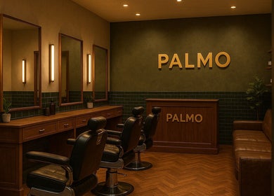 Chic salon at Palmo, Stanwell, England, GB with leather chairs, mirrors, wooden decor, cozy ambiance.