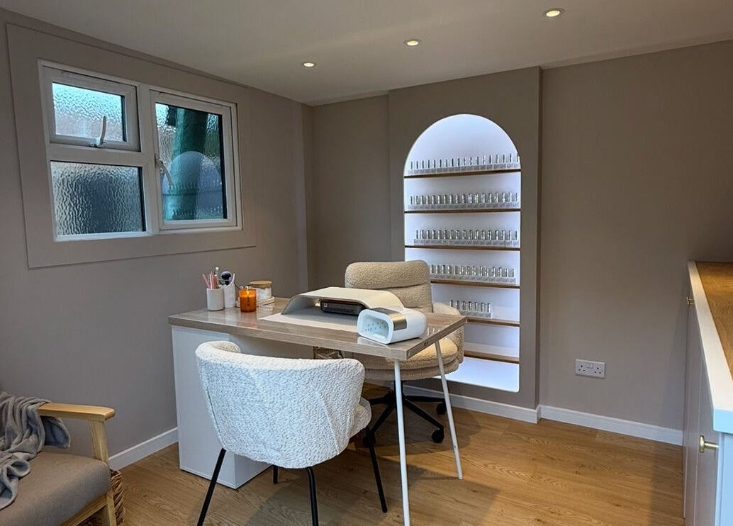 Cozy, elegant nail studio at She's Nailing It, Crawley, England, GB, featuring a stylish workspace with shelves.