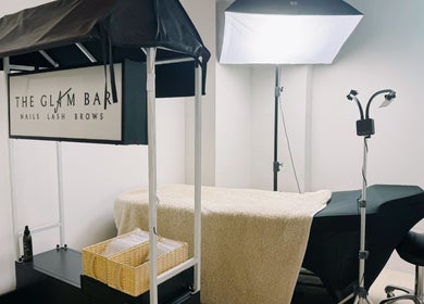 Spa treatment setup at The Glam Bar - Liang Seah, Singapore, Singapore, SG. Featuring cozy decor and professional tools.