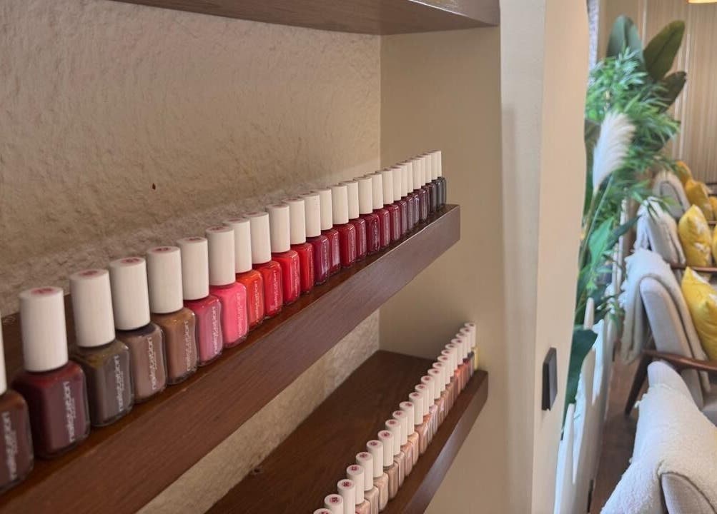 Colorful nail polish display at Blend Spa, Sharjah, AE, enhancing relaxation with vibrant aesthetics.