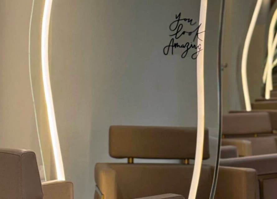 Chic mirrors and seating at Blend Spa, enhancing a luxurious ambiance in Sharjah, AE.