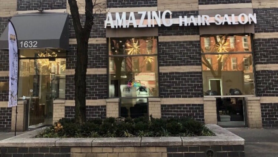 Front exterior of Amazing Hair Salon located in New York, New York, US with stylish brick facade.