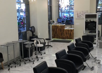 Amazing Hair Salon in New York, New York, US features modern styling chairs and chic decor.