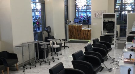 Amazing Hair Salon in New York, New York, US features modern styling chairs and chic decor.