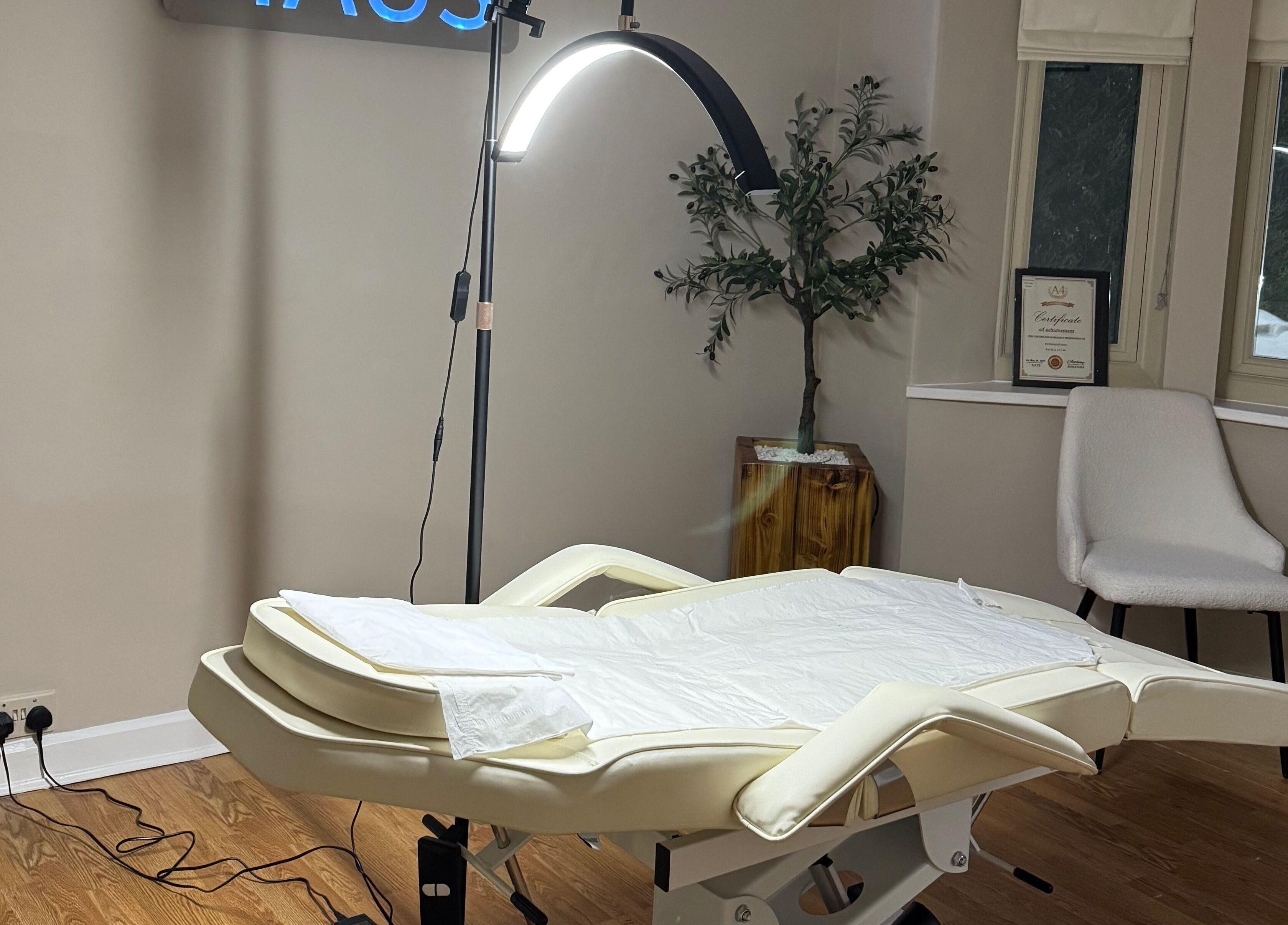 Cozy treatment room at Brow Haus, Bawtry, England, GB with a plush bed and serene lighting.