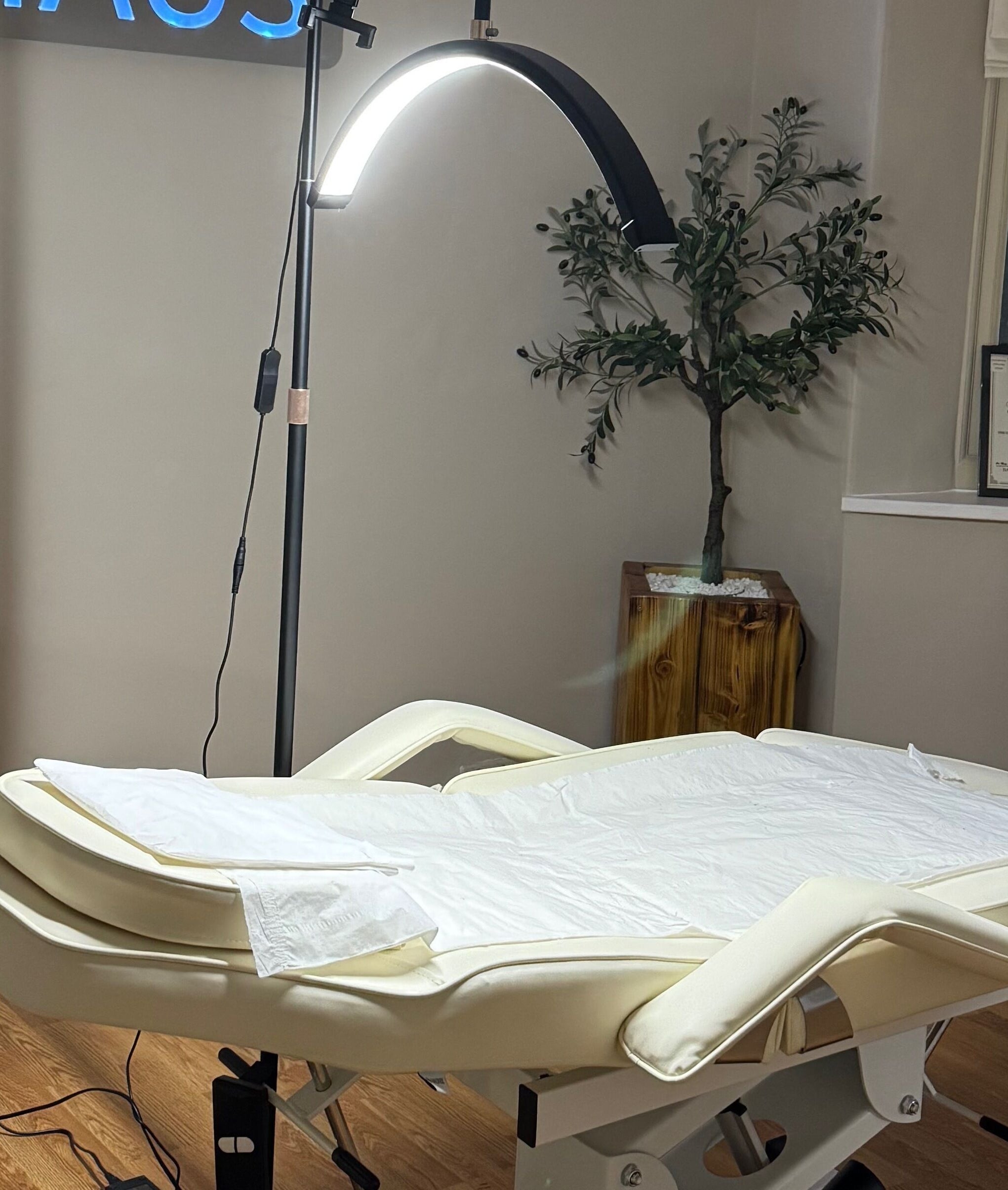 Cozy treatment room at Brow Haus, Bawtry, England, GB with a plush bed and serene lighting.