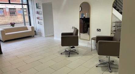 Modern interior of Dala Hair Salon Ammanford in Ammanford, Wales, GB, featuring stylish seating and large mirrors.
