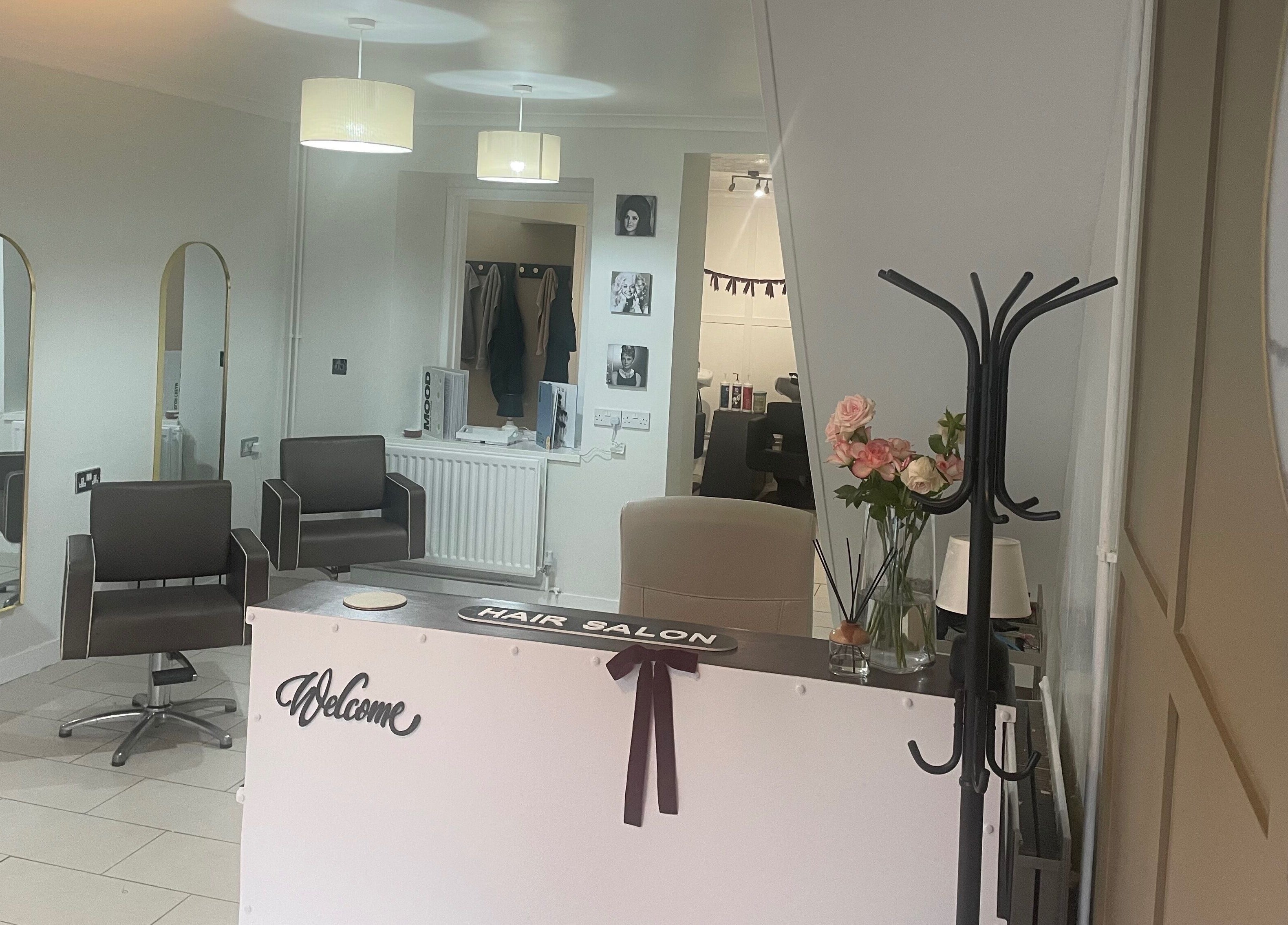 Stylish interior of Dala Hair Salon Ammanford, showcasing modern chairs and welcoming decor in Ammanford, Wales, GB.