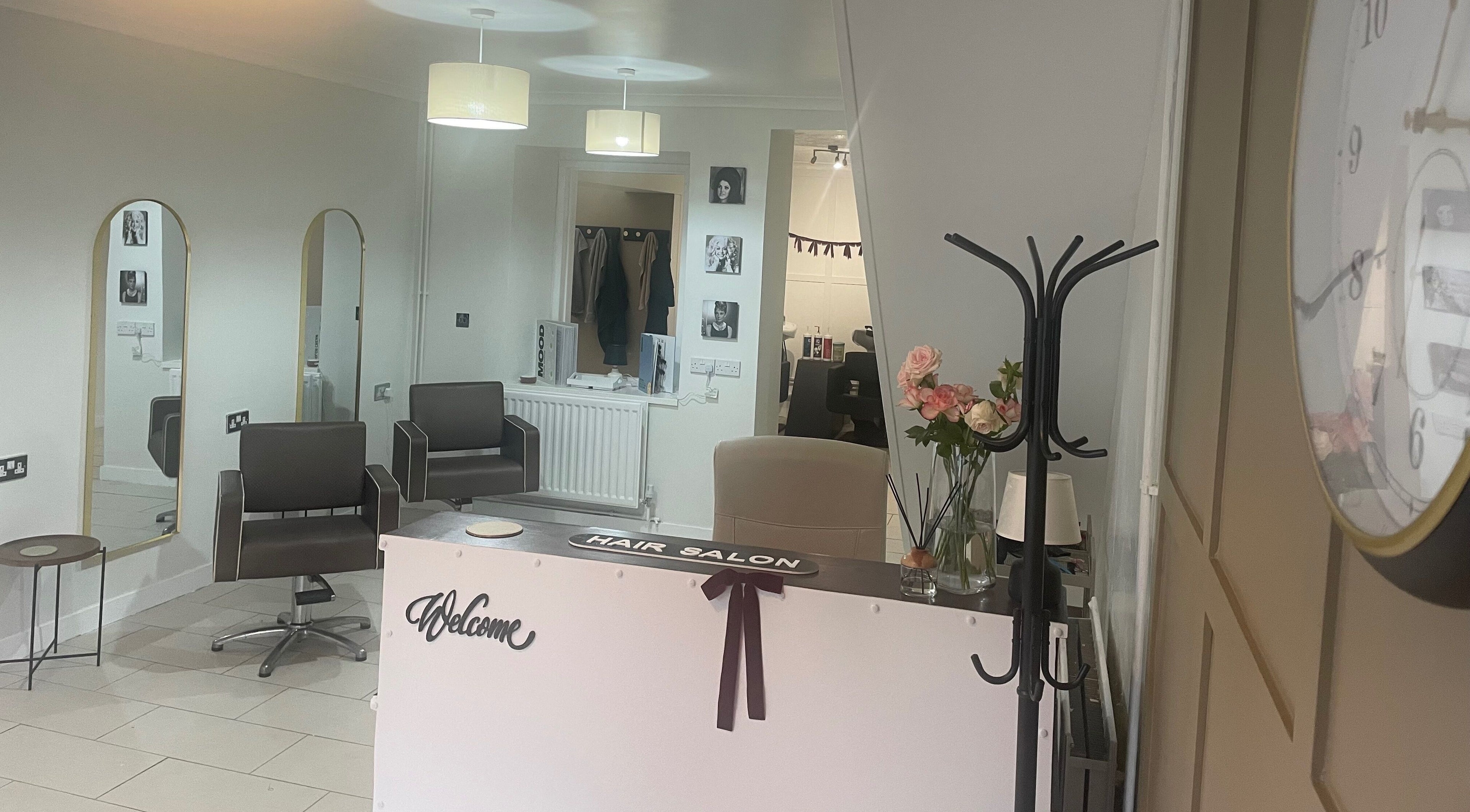 Stylish interior of Dala Hair Salon Ammanford, showcasing modern chairs and welcoming decor in Ammanford, Wales, GB.