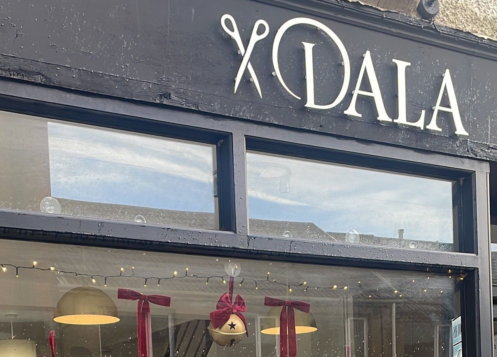 Exterior of Dala Hair Salon Ammanford with festive decorations, Ammanford, Wales, GB.