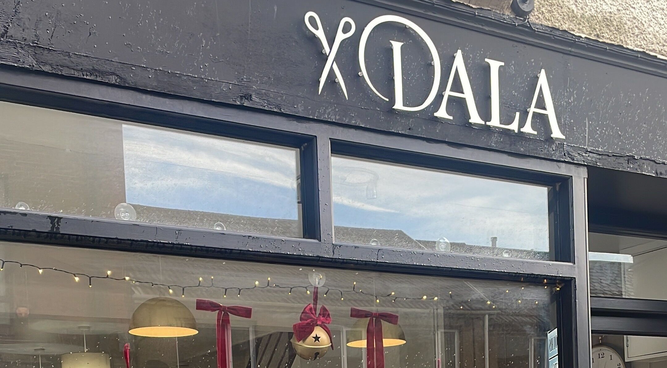 Exterior of Dala Hair Salon Ammanford with festive decorations, Ammanford, Wales, GB.
