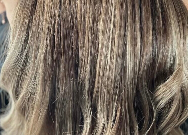 Elegant blonde waves styled at Dala Hair Salon Ammanford, located in Ammanford, Wales, GB.