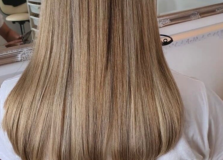 Blonde hair styled at Dala Hair Salon Ammanford, showcasing a sleek finish. Located in Ammanford, Wales, GB.