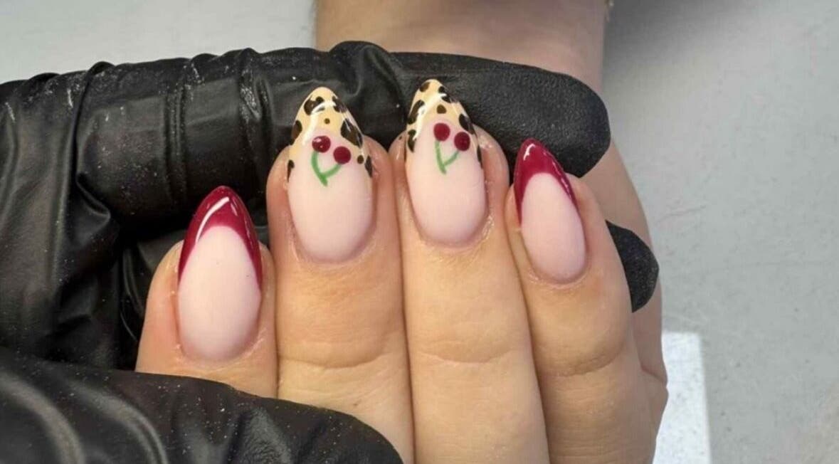 Elegant nail art with cherry design at Pearlfect Beauty, Widley, England, GB.