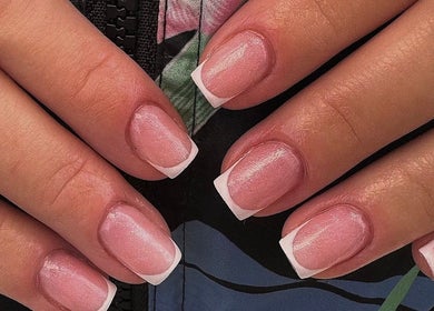 Elegant French manicure at Bisou Studio, Manchester, England, GB offering flawless beauty nail services.