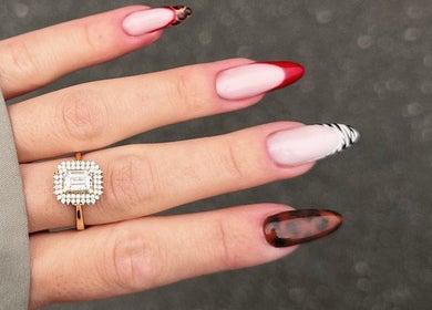 Manicured hand with creative nail art at Bisou Studio, Manchester, England, GB.
