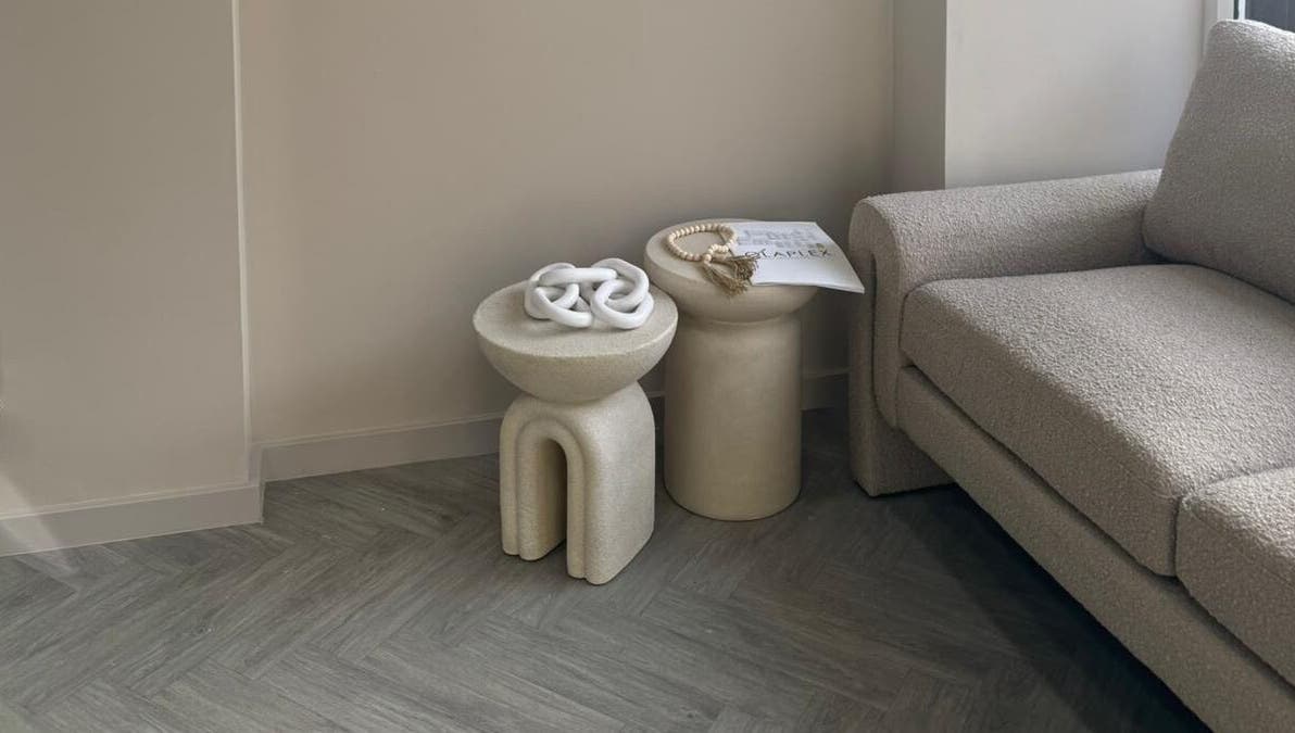 Modern cozy seating area at Bisou Nail Studio, Manchester, England, GB, with chic furniture design.