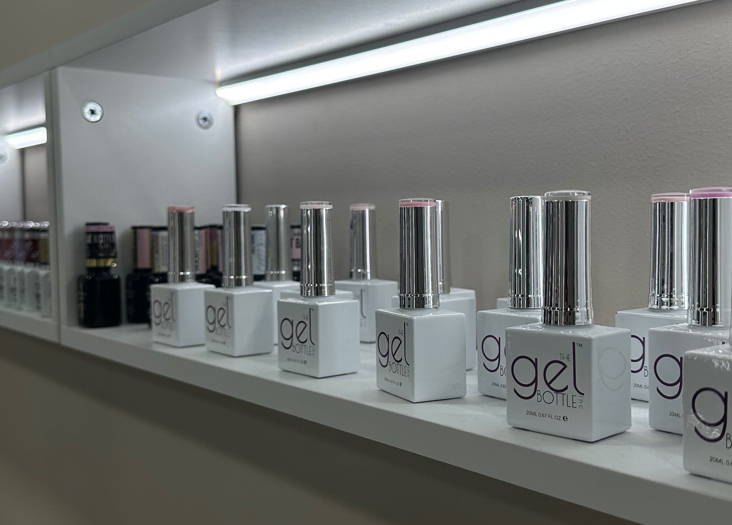 Nail polish display at Bisou Nail Studio, Manchester, England, GB, showcasing a variety of gel colors.