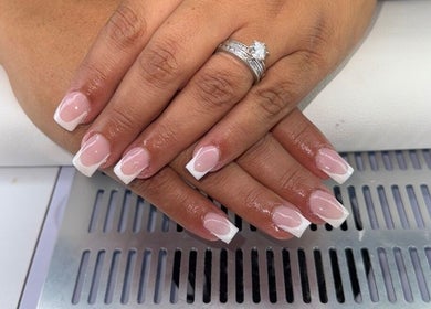 Beautiful French manicure at houseofnailsbydem in Stockton-on-tees, England, GB, showcasing elegant nail design.
