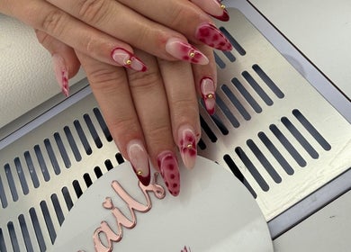 Stylish nail art with red accents at houseofnailsbydem, Stockton-on-tees, England, GB.