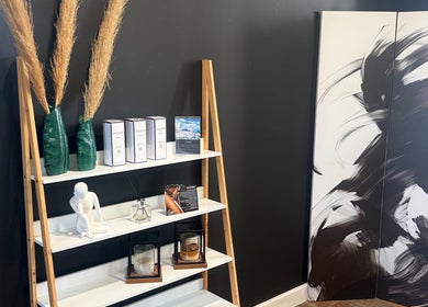 Elegant shelf display with art at Empire Nails and Beauty Studio, Sandton, Gauteng, ZA.