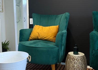 Cozy seating with green chairs at Empire Nails and Beauty Studio, Sandton, Gauteng, ZA.